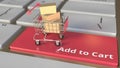 Add to Cart text on computer keyboard and boxes in small shopping cart. Electronic business conceptual 3d rendering Royalty Free Stock Photo