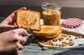 Add to ruddy toast peanut butter, hand, delicious breakfast Royalty Free Stock Photo