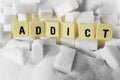 Addict block letters word on pile of sugar cubes close up in sugar addiction concept Royalty Free Stock Photo