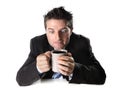 Addict business man in suit and tie holding cup of coffee anxious and crazy in caffeine addiction Royalty Free Stock Photo