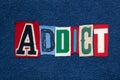 ADDICT text word collage, colorful fabric on blue denim, health and addiction concept Royalty Free Stock Photo