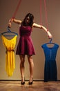 Addicted to shopping woman girl marionette with clothes Royalty Free Stock Photo