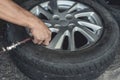 Adding air pressure into a newly vulcanized tire. Attaching an air hose into the valve stem