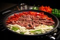 adding beef strips to sizzling pan for beef fajita Royalty Free Stock Photo