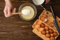 Adding flour to eggs mixed with milk? top view Royalty Free Stock Photo