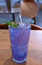 Adding Fresh Lime Juice into Iced Butterfly Pea Flower Tea