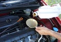 Adding Motor Oil to Car