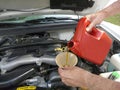 Adding Motor Oil to Car Royalty Free Stock Photo