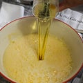 Adding oil for cooking a Italian cake