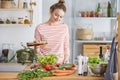 Adding olive oil to salad