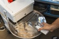 adding salt to the electric dough mixer machine, dough kneading process