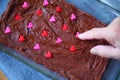 Pressing candy hearts into fudge