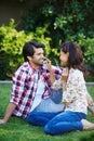 Adding some silly to the day. a young couple enjoying some playful time outdoors.