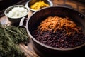 adding spices like juniper berries to sauerkraut