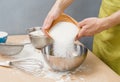 Adding sugar to the raw bakery daugh Royalty Free Stock Photo