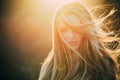 Adding volume to her long hair. Sensual woman with wavy long hair outdoor. Pretty girl with beautiful healthy hair in Royalty Free Stock Photo