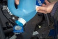 Adding winter windscreen washer fluid in the car Royalty Free Stock Photo