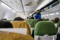 Addis Ababa, Ethiopia - April 23, 2019: Commercial plane interior before take off, most of passengers already seated, baggage