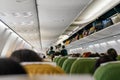 Addis Ababa, Ethiopia - April 23, 2019: Commercial plane interior before take off, most of passengers already seated, baggage