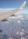 Addis Ababa, Ethiopia - May 07, 2019:  View from passenger window of Ethiopian airlines Boeing 737 commercial airplane, clouds on. Royalty Free Stock Photo