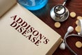 Addisons disease written on book with tablets. Royalty Free Stock Photo
