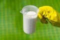 Addition of chlorine powder for the pool to remove algae and disinfect water. inflatable swimming pool care concept.