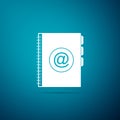 Address book icon isolated on blue background. Notebook, address, contact, directory, phone, telephone book icon. Flat Royalty Free Stock Photo