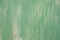 aded from time and weather painted in a light pastel green metal surface with cracks, streaks and rust. Background, structure Royalty Free Stock Photo