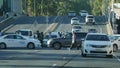 People and traffic crossing busy road