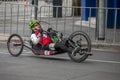 A Para Cyclist riding a handcycle races along Pulteney Street in Adelaide.