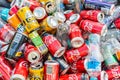 Pile of soft drink cans and plastic bottles