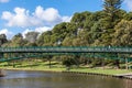 The Adelaide University Footbridge over river Torrens Karrawirra Parri. People at the park walking, fishing, riding a bike. Royalty Free Stock Photo