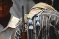 Yemeni man holds a rifle on his shoulder at the street in Aden, Yemen.