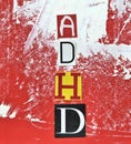 ADHD. Abbreviation ADHD from paper letters . Chaotic red white stripes spots background. ADHD is Attention deficit hyperactivity