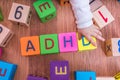 ADHD concept. Baby is playing with cubes with letters