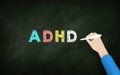 ADHD Hand writing In Chalk background. is one of the most common neurodevelopmental disorders of childhood