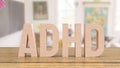 Adhd wood text on table in class room for medical or education concept 3d rendering