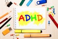 ADHD written on sheet of paper by crayons. ADHD is Attention deficit hyperactivity disorder Royalty Free Stock Photo