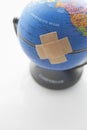 Adhesive Bandage On Globe Royalty Free Stock Photo