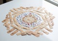 Adhesive bandages arranged in a circular pattern on a white surface. The design includes varying Royalty Free Stock Photo