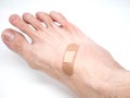 Adhesive Healing plaster on asian man foot