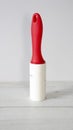 Adhesive lint roller, the device used to remove small dust or fibers on the material such as clothes or linens.