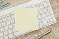 Adhesive note on keyboard Royalty Free Stock Photo