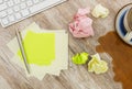Adhesive note on messy desk Royalty Free Stock Photo