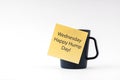 Adhesive note with text Wednesday Happy Hump Day stick on a cup of drink on white background Royalty Free Stock Photo