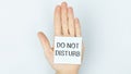 the palm of the hand with the text Do Not Disturb