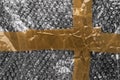 Adhesive tape on a bubble wrap. Wrinkled abstract plastic surface Royalty Free Stock Photo