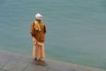 A Sadu ready to pray on the banks of the holy river Ganges in Varanasi, India