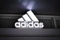 Adidas brand logo on at adidas store sport fashion clothing and accessories. Adidas German company first making athlete sport. 9