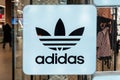Adidas logo. Adidas neon store sign in shop window. Minsk, Belarus, 2023